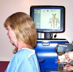 Patient receiving a surface EMG and thermal spinal scan